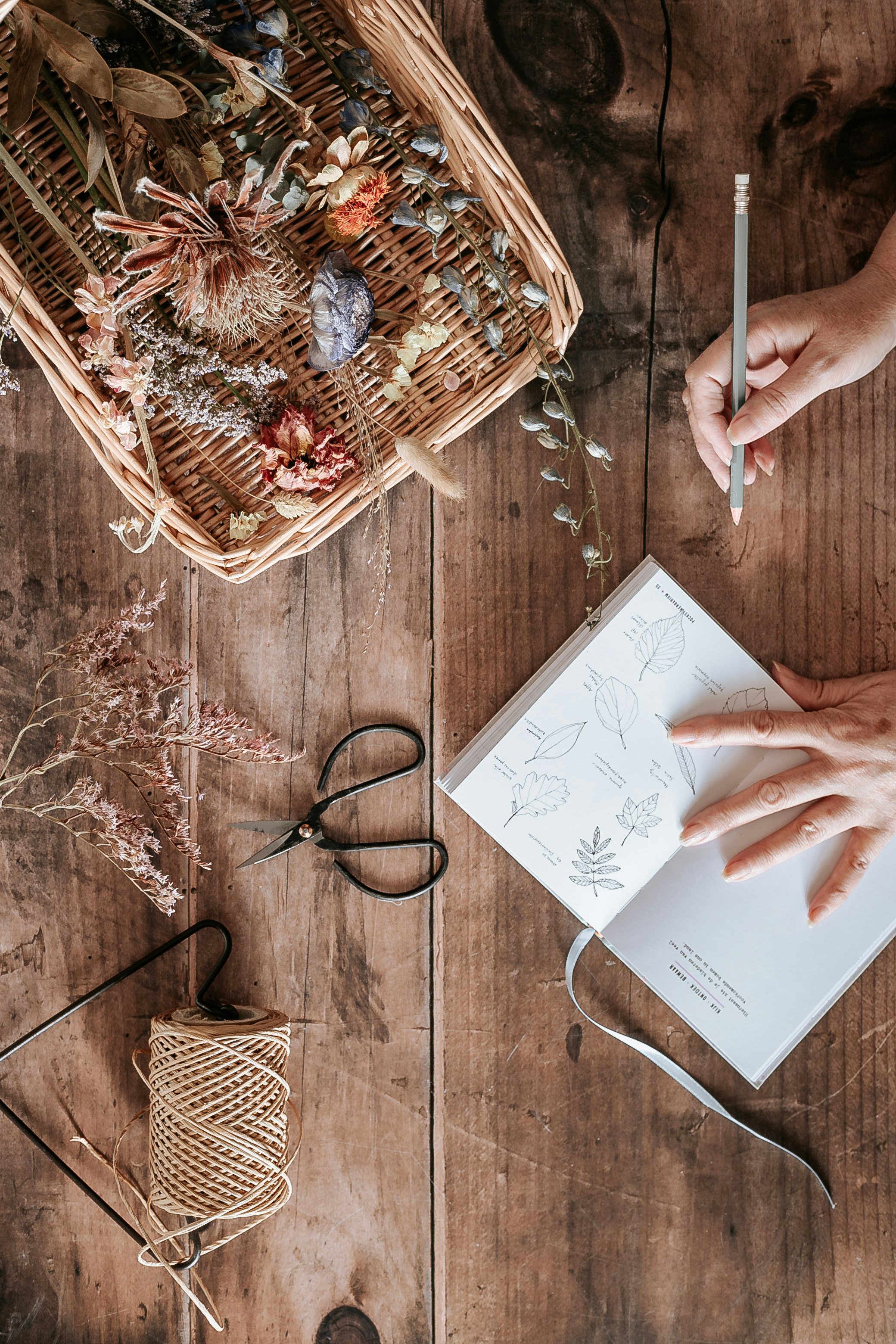 person writing on white paper